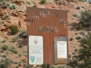 behind_the_rocks_sign